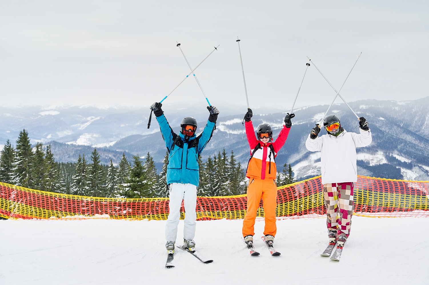 friends-skiers-having-fun-at-ski-resort-in-the-mou